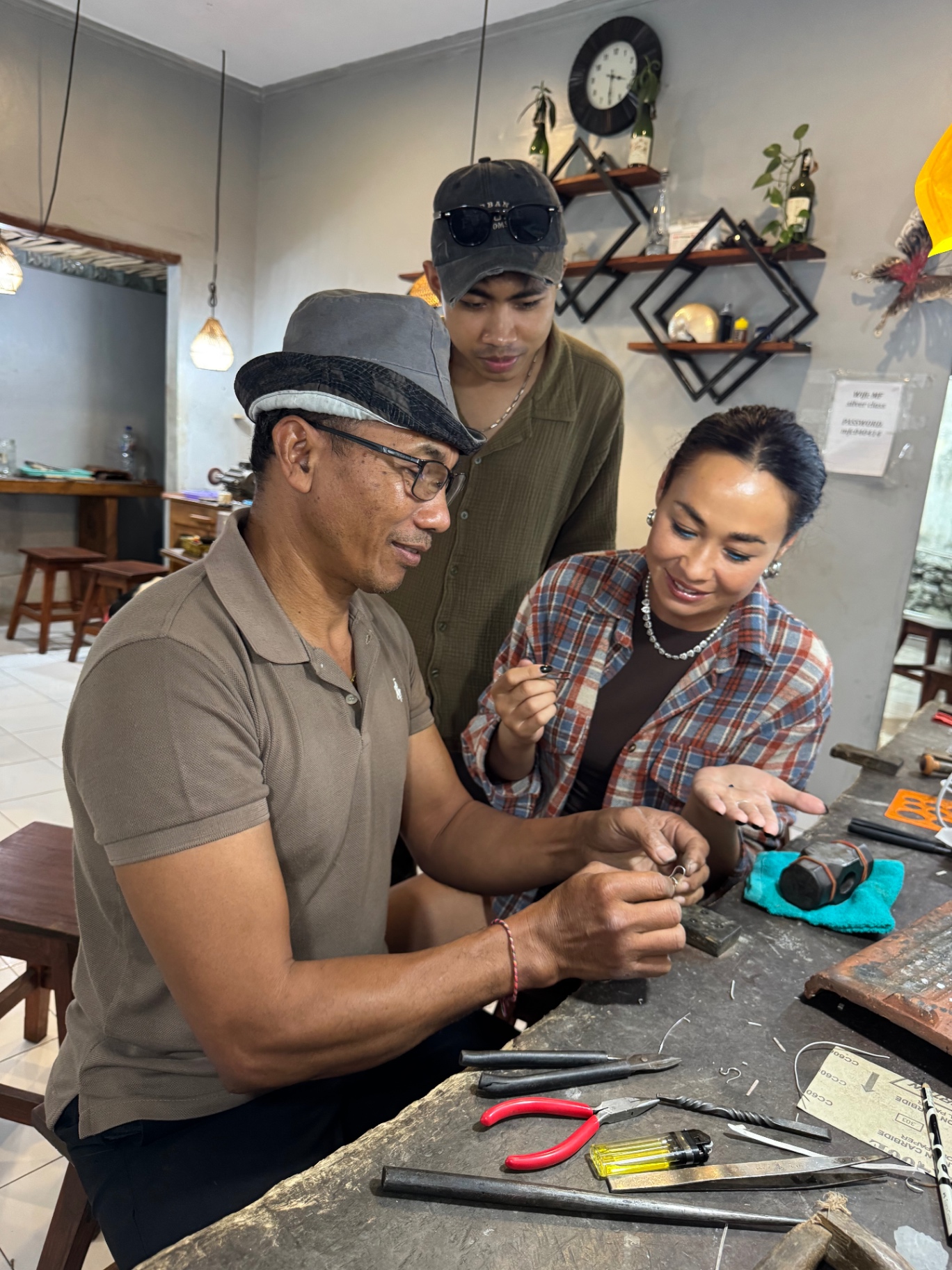 The founder and the silversmith together at the workbench in the Bali workshop